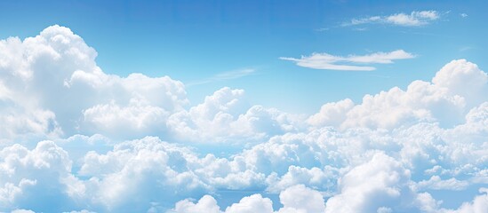 Aufkleber - An awe inspiring photograph capturing the beauty of a clear blue sky adorned with fluffy clouds during the daytime A serene and picturesque image showcasing the wonders of nature s canvas