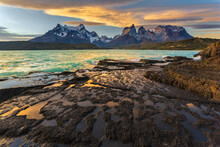 View of the Andes mountain range from the lakeside at sunset, Chile.