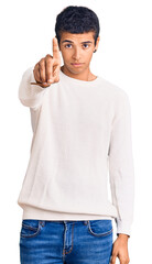 Canvas Print - Young african amercian man wearing casual clothes pointing with finger up and angry expression, showing no gesture