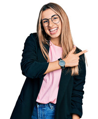 Poster - Hispanic young woman wearing business jacket and glasses cheerful with a smile on face pointing with hand and finger up to the side with happy and natural expression