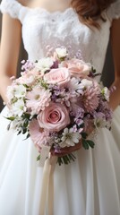 Wall Mural - Beautiful fresh bouquet of flowers in the hands of the bride close-up