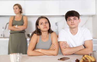 Sticker - Portrait of thoughtful woman who had conflict with adult children while cooking dinner in home kitchen