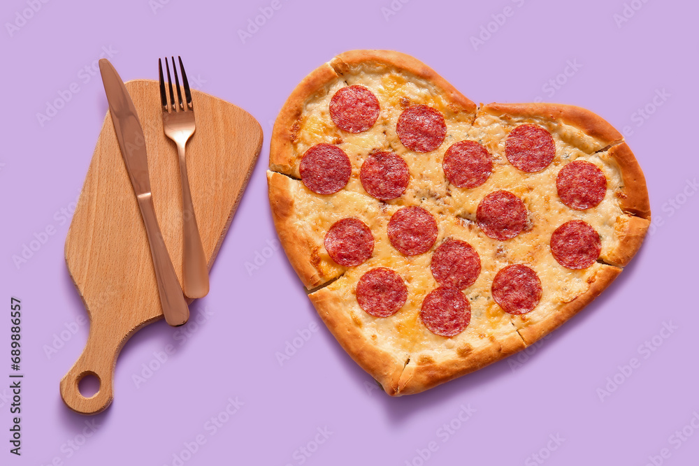 Tasty heart shaped pizza on lilac background