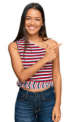 Sticker - Beautiful hispanic woman wearing casual clothes cheerful with a smile of face pointing with hand and finger up to the side with happy and natural expression on face