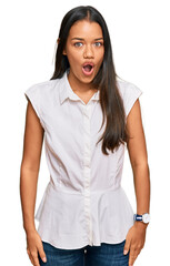 Canvas Print - Beautiful hispanic woman wearing casual clothes scared and amazed with open mouth for surprise, disbelief face