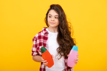 Poster - Child with shampoo conditioner. Daily cosmetic care. Teenager kid 12, 13, 14 years old hold bottle of hair and skin care. Beauty health and cosmetics.