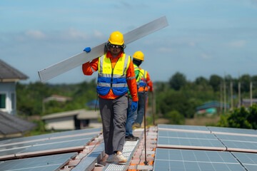 Worker Technicians are working to construct solar panels system on roof. Installing solar photovoltaic panel system. Alternative energy ecological concept. Renewable clean energy technology concept.