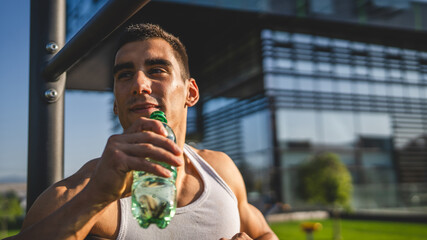 Poster - man young male athlete hold bottle of water drink training outdoor