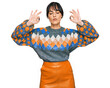 © Krakenimages.com - Young hispanic woman wearing casual clothes relax and smiling with eyes closed doing meditation gesture with fingers. yoga concept.