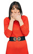 © Krakenimages.com - Young hispanic woman wearing casual clothes shocked covering mouth with hands for mistake. secret concept.