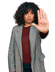 Poster - Young hispanic woman wearing business clothes doing stop sing with palm of the hand. warning expression with negative and serious gesture on the face.