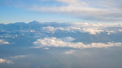 Wall Mural - High mountains shrouded in clouds