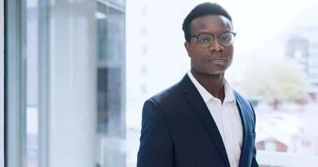 Poster - Face, business and a serious black man at a window in his office for professional work or career. Portrait, corporate and glasses with a confident young employee in a suit at his workplace in the day