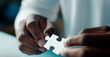 © Phichitpon - Hand holding jigsaw puzzles, Business partnership concept.AI Generative
