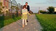 parent, recess, father daughter spins, schoolchild running, children game superhero with parent, happy girl runs into her father arms, smile face, father, girl running from class, schoolgirl running