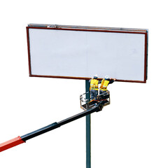 Two workers upgrading billboard outdoor, on roadside of city street, isolated on a white background