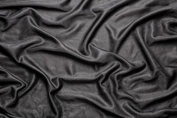 Wall Mural - black cloth fabric in soft folds, top view