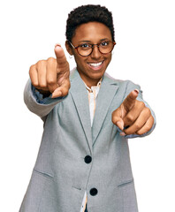 Sticker - Young african american woman wearing business clothes pointing to you and the camera with fingers, smiling positive and cheerful