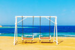© lizavetta - Swing on the shore of the Red Sea.