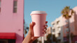 Pink paper cup with coffee in woman hand. Time for drink coffee in city. Coffee to go. Enjoy moment, take a break. Disposable paper cup closeup. Delicious hot beverage. Mockup. Generated AI
