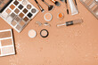 Flat lay of Makeup cosmetic product. New trending PANTONE Peach Fuzz colour of 2024 year