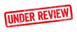 Red stamp on a white background - Under review