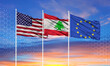 Three realistic flags of European Union, United States and Lebanon on flagpoles and blue sky.