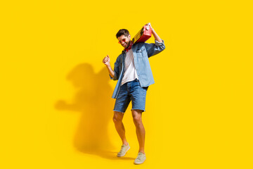 Poster - Full body photo of eccentric man dressed denim shirt shorts in glasses dance with boombox on shoulder isolated on yellow color background