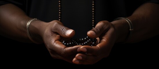 Wall Mural - Prayer rosary and hands of black man for worship faith and belief for support help and hope Religion praying and christian person in home for meditation spiritual healing and trust for praise