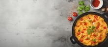 Mexican Food Recipes Revoltillo De Huevos Scrambled Eggs A La Dominicana In Portioned Skillet On Dark Stone Table Copy Space Top View. Website Header. Creative Banner. Copyspace Image