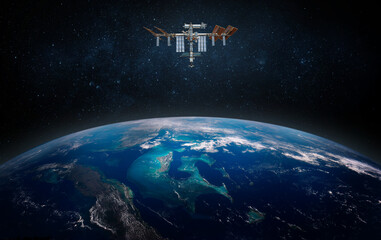 Wall Mural - The International Space Station orbiting planet Earth. Elements of this image furnished by NASA. Scientific space exploration using a space station.