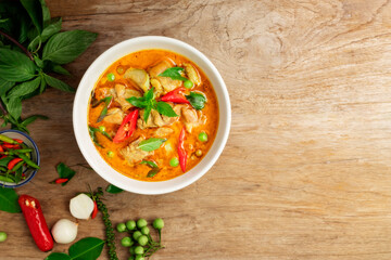 Canvas Print - Chicken green curry Asian food, Beef green curry Thai food on a soup bowl with a mixture of herbs, vegetables and Thai red chilli spices. Top view.