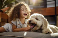Little Girl Playing With Her Dog At Home. Cute Curly Haired Girl Playing With Her Pet At Home