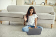 Pre-teen girl using laptop start videocall talk to friend