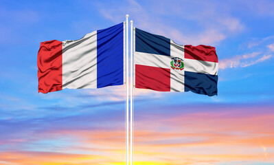 france and Dominican Republic two flags on flagpoles and blue cloudy sky . Diplomacy concept, international relations