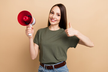 Poster - Portrait of smiling girl showing thumb up like gesture support people from lgbt community hold megaphone isolated on beige color background