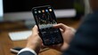 © Elvin - Trader using mobile app for crypto market analysis, trading