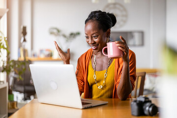 Mature woman working on laptop at home
