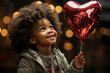 © Sheila - African boy holding a heart shape balloon during Valentine's day