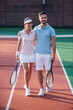 © georgerudy - Couple playing tennis