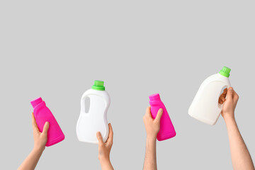 Sticker - People with bottles of laundry detergent on light background