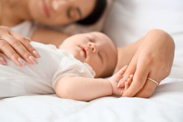 Sticker - Mother with her little cute baby sleeping in bedroom at home