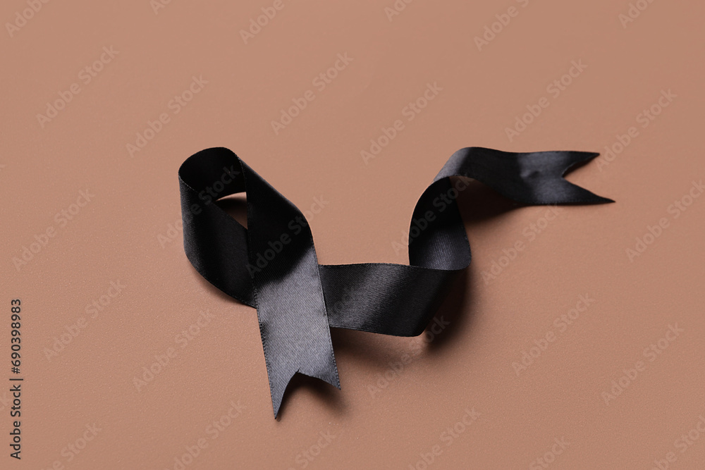 Black funeral ribbon on brown background