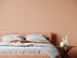 Bedroom in delicate peach fuzz color trend 2024 year panton furniture and accent wall. Modern luxury room interior home or hotel design. Empty warm apricot paint background for art.3d render 