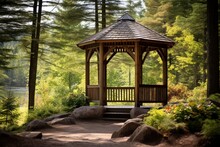 A Simple Wooden Gazebo Positioned At A Bend In The Trail, Offering A Quiet Spot To Appreciate The Surrounding Natural Beauty. Trailside Gazebo.