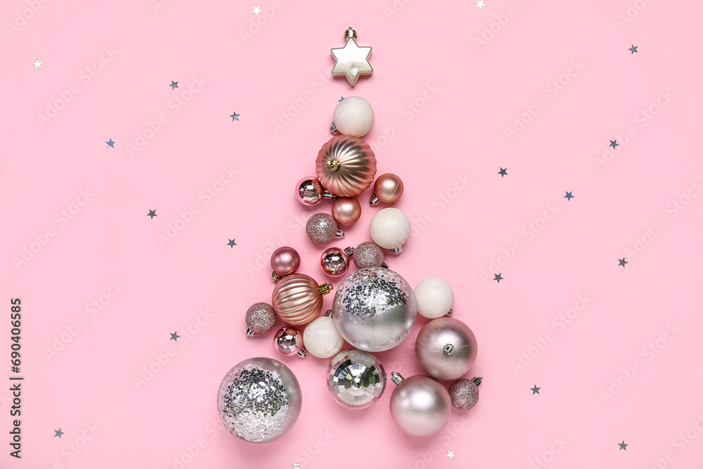 Christmas tree made of balls and confetti on pink background