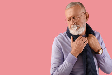 Wall Mural - Sick mature man on pink background