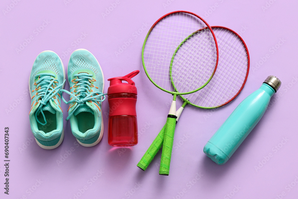 Set of sports equipment on lilac background