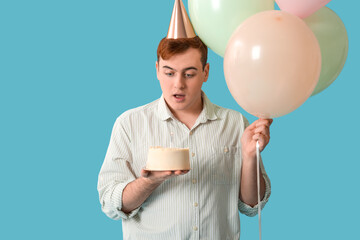 Sticker - Young man in party hat with sweet cake and air balloons celebrating Birthday on blue background