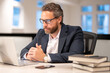© Volodymyr - Business offices place. Businessman working with laptop in office. Business man director using laptop. Millennial manager at office workplace. Office workers business people at office.